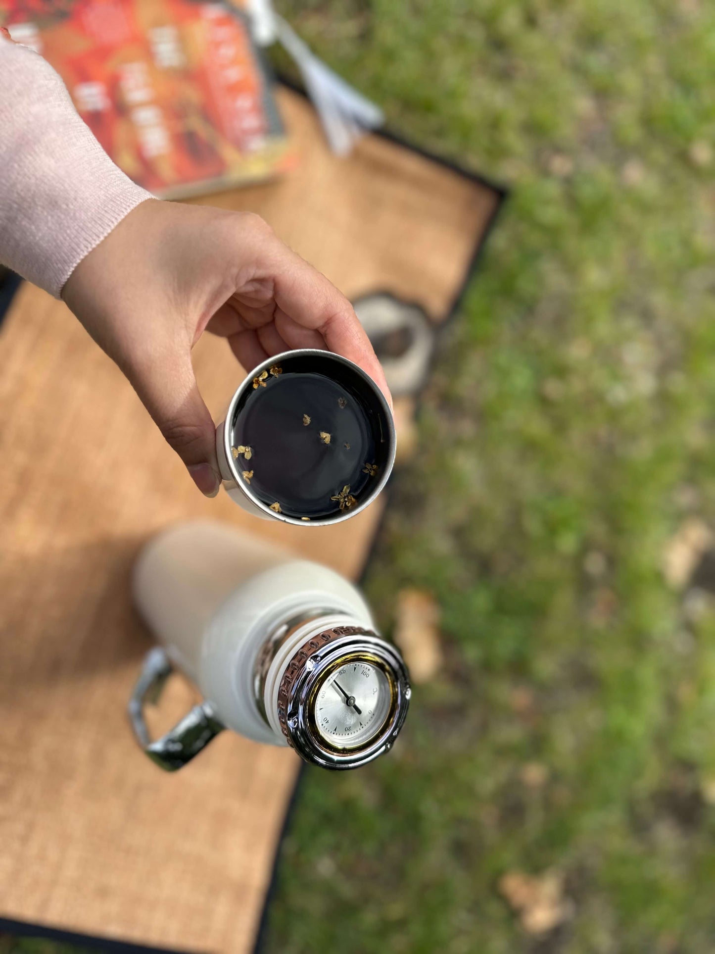 tea flask with cup filled with puerh tea