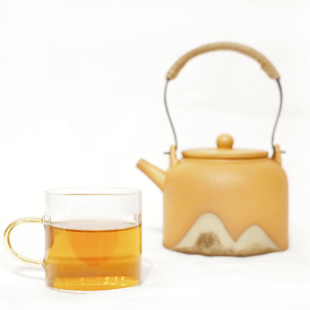 award winning Tasmanian lavender puerh tea in cup and teapot in the back