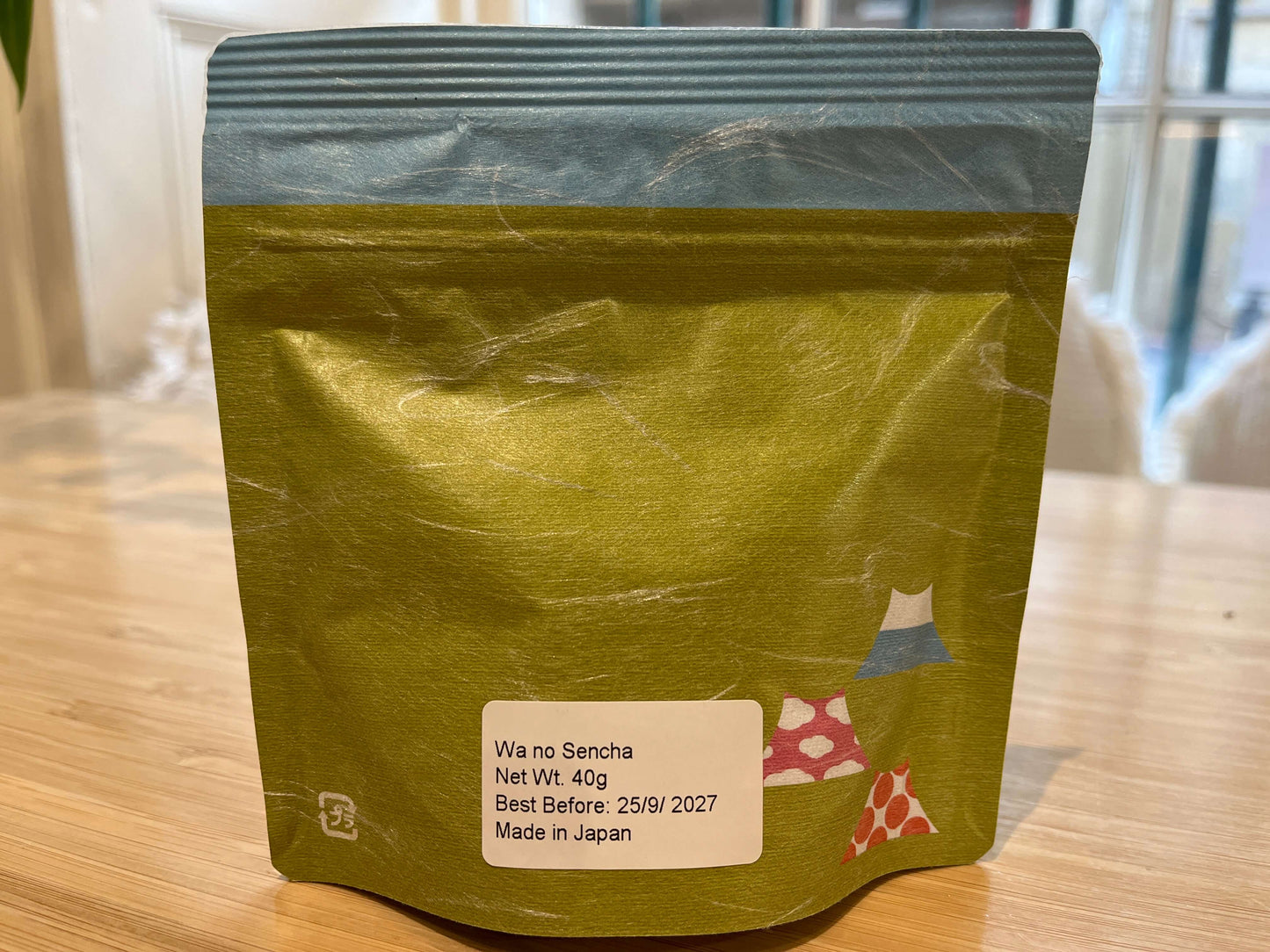 Wa no Sencha Japanese green tea package on a wooden surface