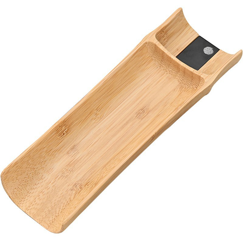 Bamboo digital tea scale on a white background, showing the carved trough and hidden display panel