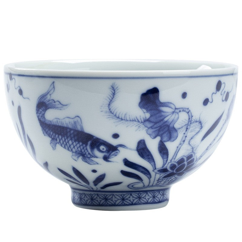 Matching cup from the Blue and White Gaiwan Tea Set, fish and waterweed pattern, on white