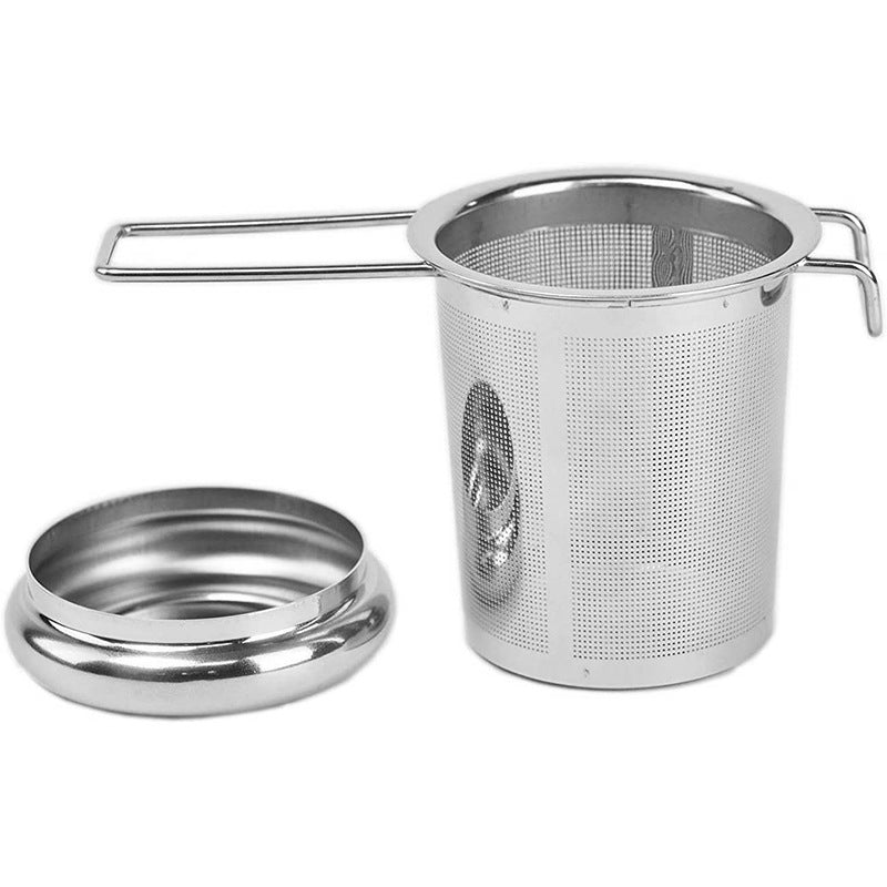 Tea infuser basket with the lid removed and set beside it