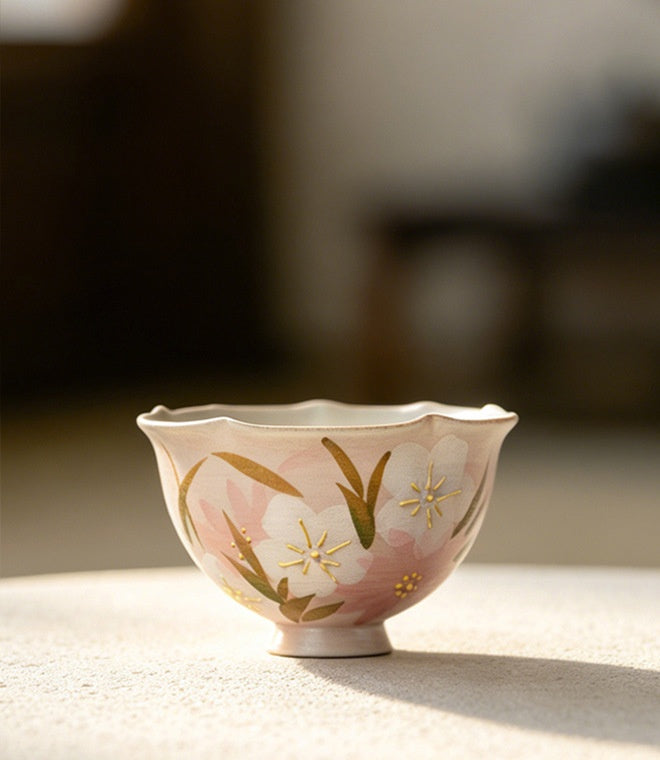 Peach pink wildflower footed tea cup 100ml on a sunlit table