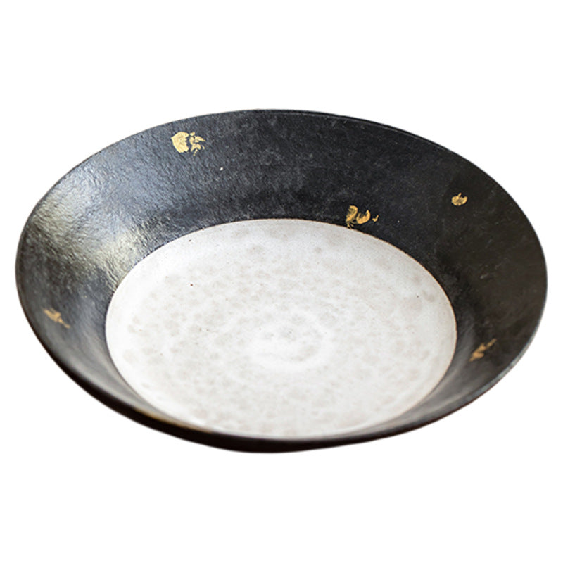Black clay teapot stand with gold flecks and white crackle centre on a white background