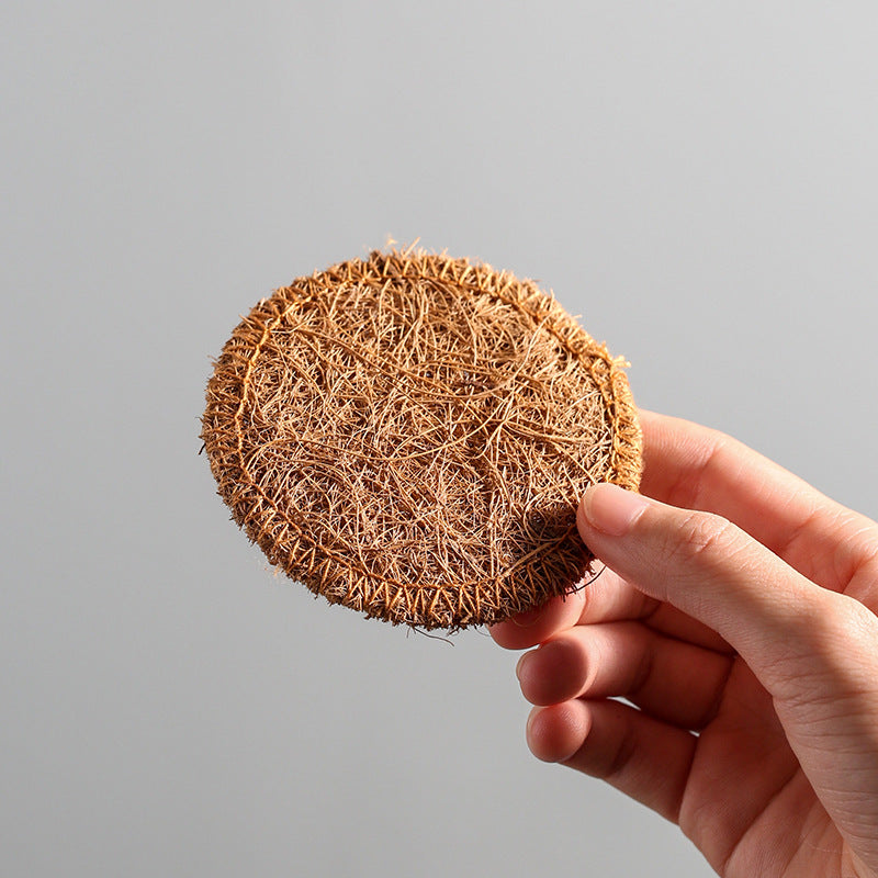 Natural loofah fibre coaster with stitched edge