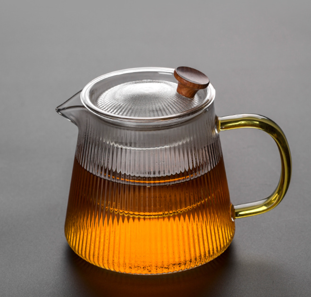 800ml Glass Teapot with Removable Infuser filled with tea, amber glass handle and walnut knob