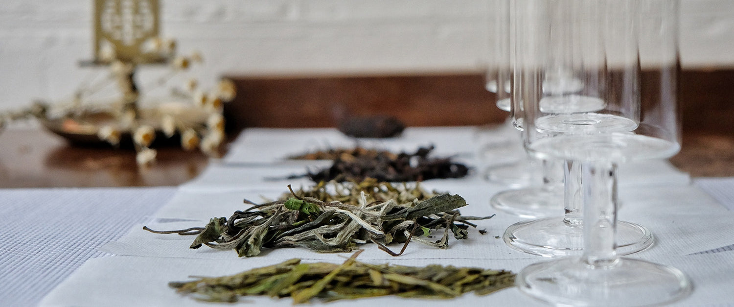 A selection of loose tea on top of a table