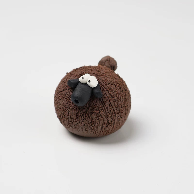 Chocolate brown hand-pinched pottery sheep tea pet with scratched fleece texture